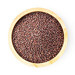Top view of small round reddish-brown mustard seeds filling a light wooden bowl on a white background