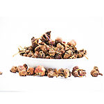 Loose dried Aik buds piled in a white bowl on a white background