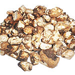 Loose irregular dried Bakbouka pieces in cream, beige and brown tones on a white background