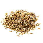 Close-up of loose whole brown caraway seeds with pale ridges on a white background