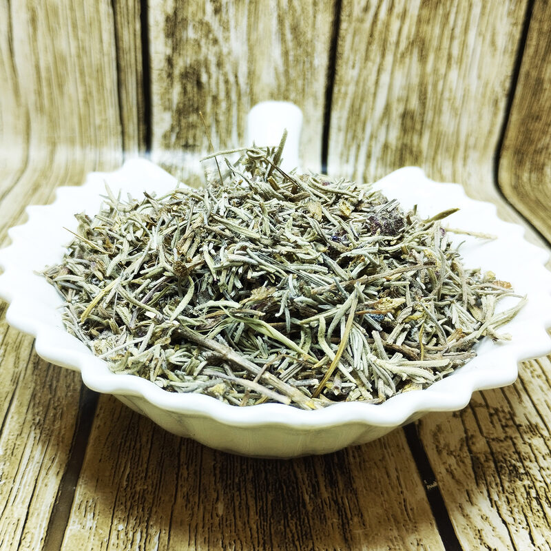 Dried grey-green Halhal sprigs and narrow leaves piled on a white dish