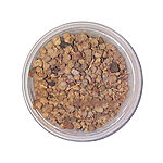 Top view of a clear round tub filled with small light and dark brown dried takaout galls mixed with fine twig fragments