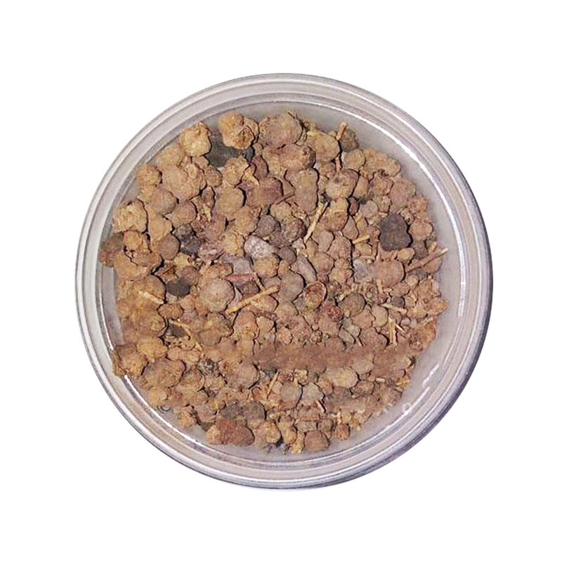 Top view of a clear round tub filled with small light and dark brown dried takaout galls mixed with fine twig fragments