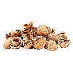 Loose broken light-brown walnut shell pieces on a white background