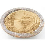 Fine pale beige Eldad powder in a shallow round bowl