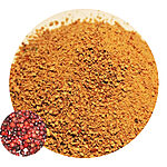 Coarse golden-brown doum powder in a round close-up with whole fruits inset