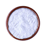 Fine white alum powder in a round dark wooden bowl on a white background